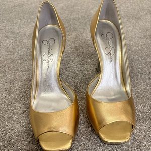 Gold Jessica Simpson open toe heels.